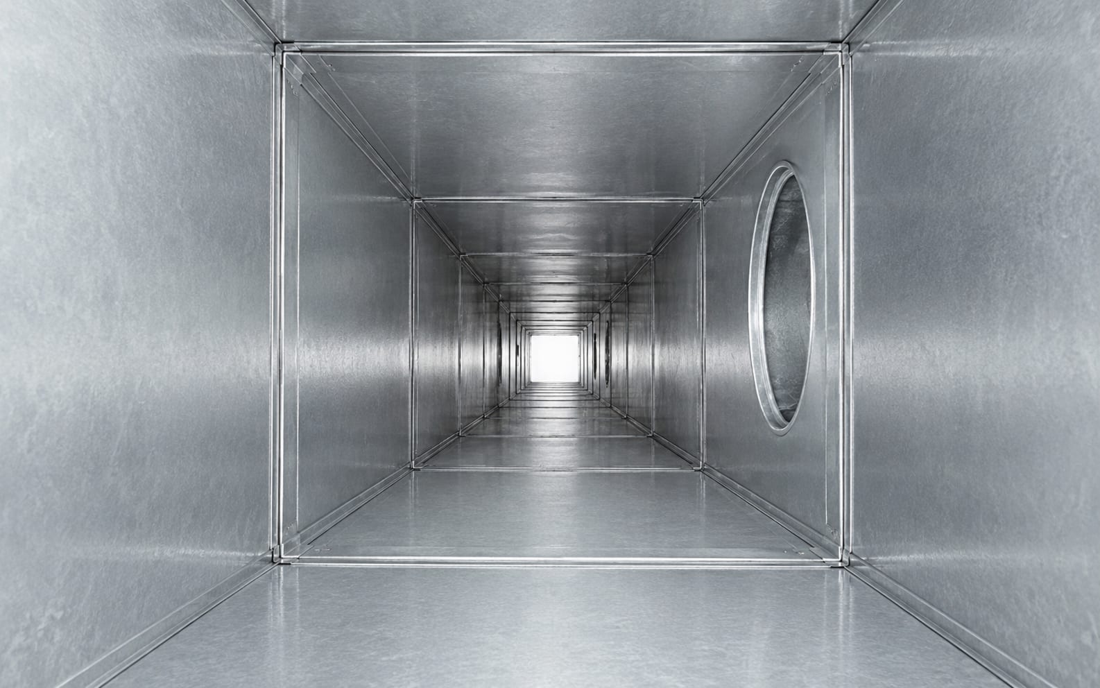 Removes dust buildup — duct interior after professional cleaning